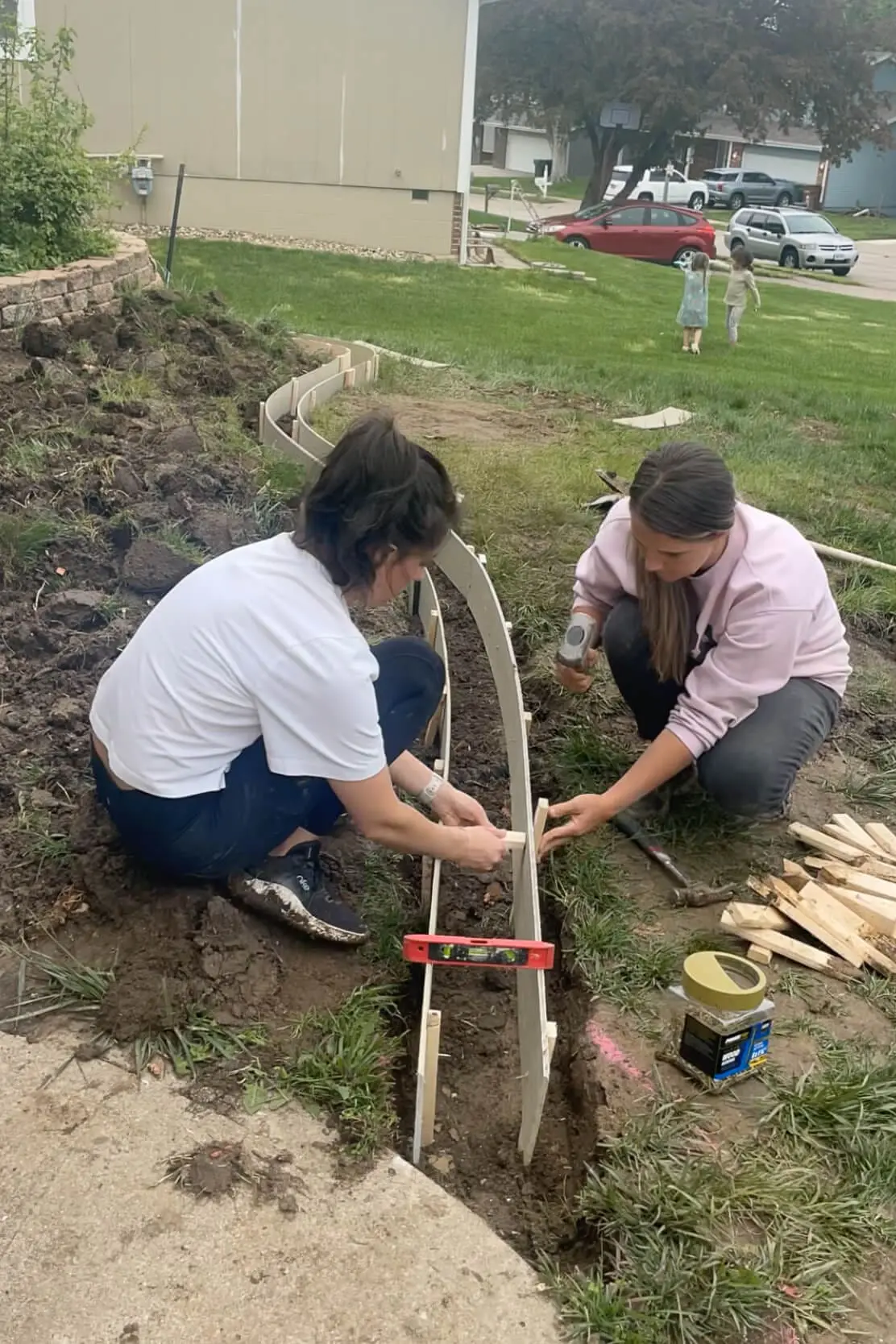 Staking in concrete forms before pouring concrete. 